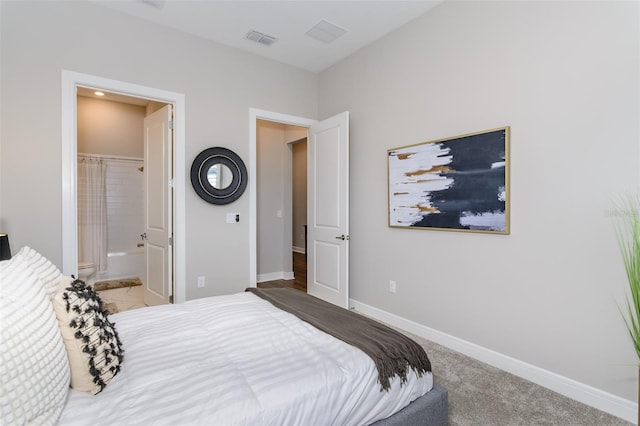 carpeted bedroom featuring connected bathroom