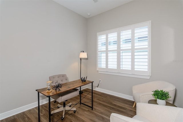 home office with dark wood-type flooring