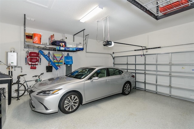 garage featuring tankless water heater and a garage door opener