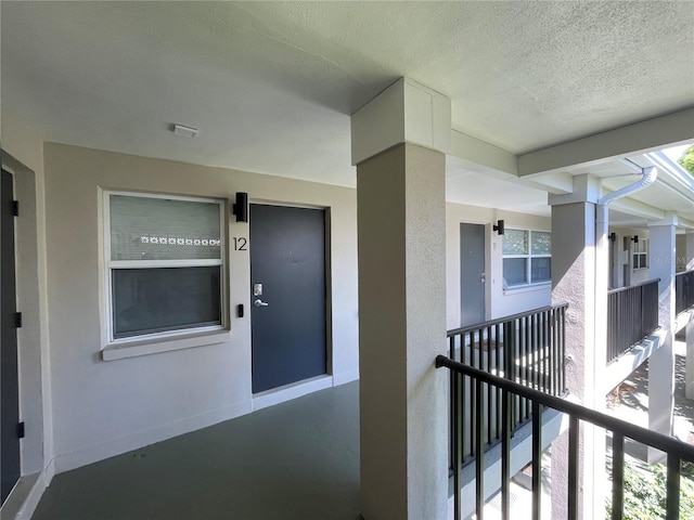 doorway to property featuring a balcony