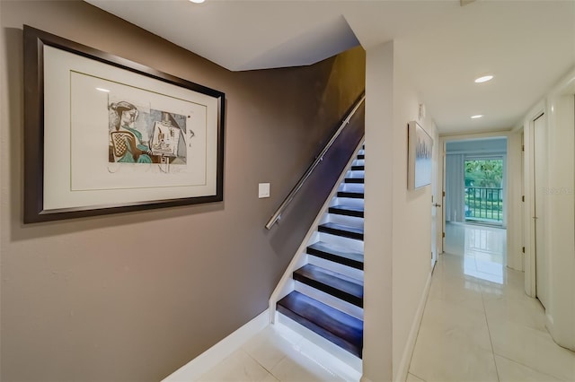 stairs with tile patterned flooring