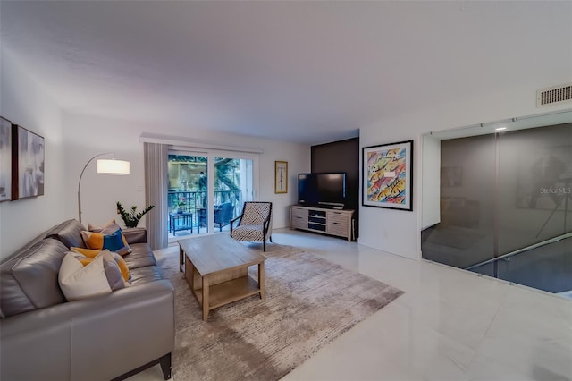 living room with tile patterned flooring