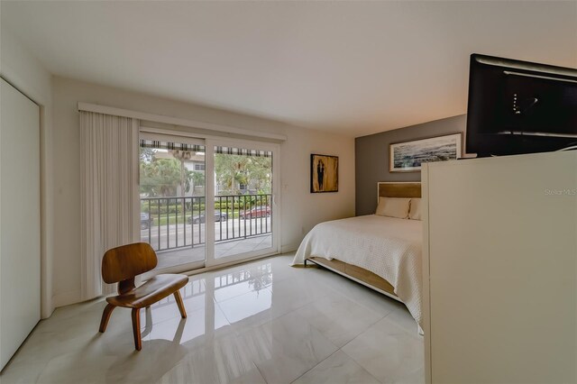 tiled bedroom featuring access to outside