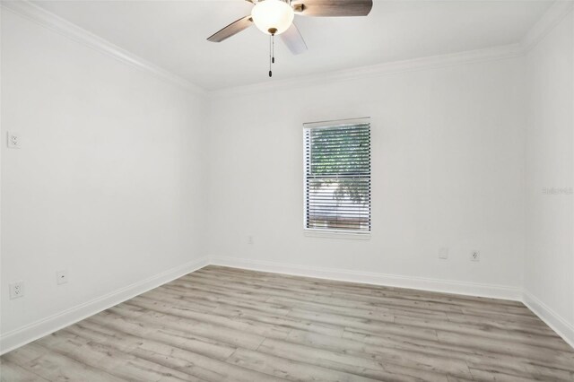 spare room featuring ornamental molding, light hardwood / wood-style floors, and ceiling fan