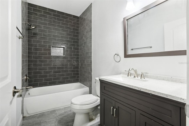 full bathroom featuring vanity, toilet, and tiled shower / bath combo