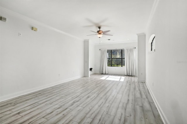 unfurnished living room with a ceiling fan, light wood-type flooring, crown molding, and baseboards