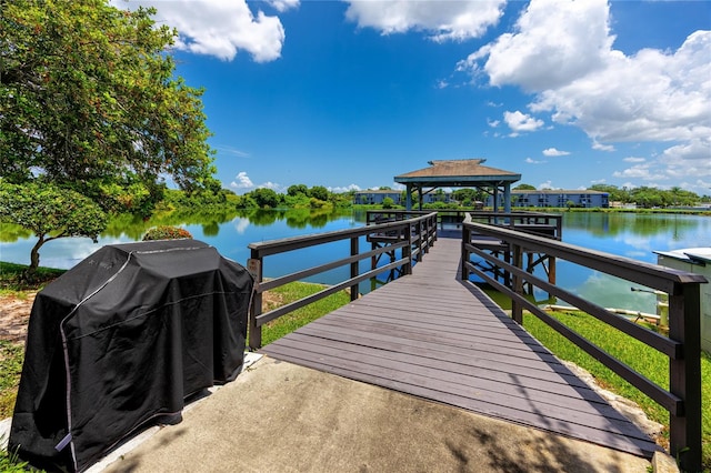 dock area with a water view and a gazebo