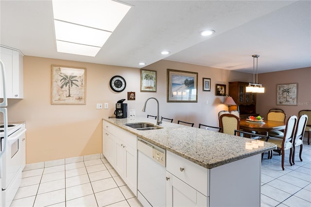 kitchen featuring sink, white appliances, decorative light fixtures, and white cabinets