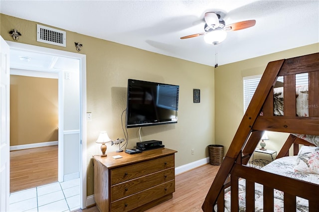 bedroom featuring ceiling fan and light hardwood / wood-style flooring