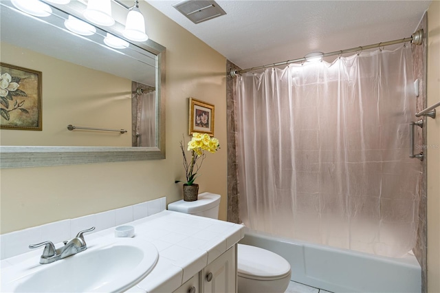 full bathroom featuring vanity, shower / bath combination with curtain, and toilet