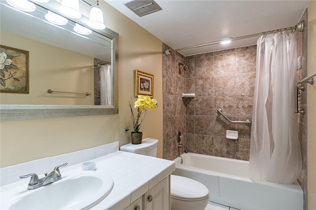 full bathroom with vanity, toilet, and shower / bath combo with shower curtain