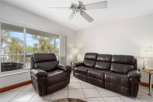 living room featuring light tile patterned flooring and ceiling fan