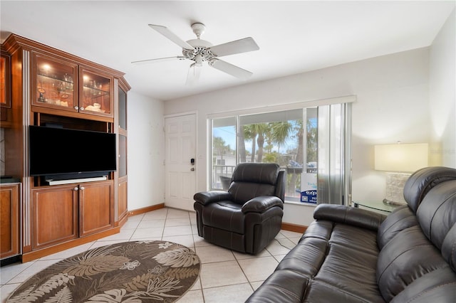 tiled living room featuring ceiling fan