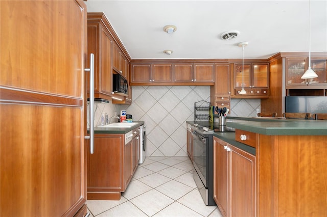 kitchen featuring hanging light fixtures, range with electric cooktop, tasteful backsplash, and light tile patterned floors