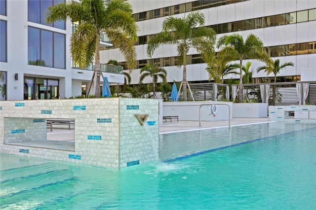 view of pool featuring pool water feature