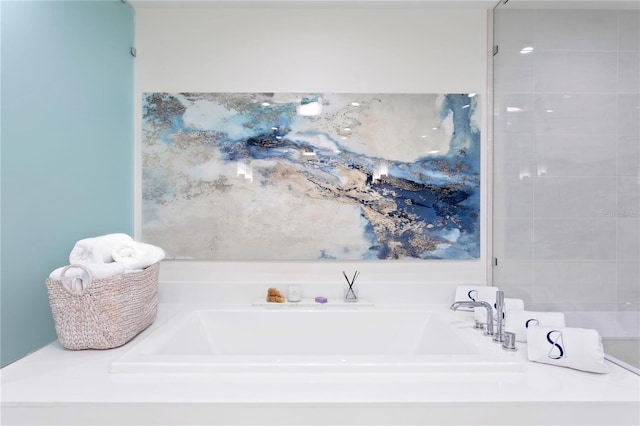 bathroom with a tub to relax in