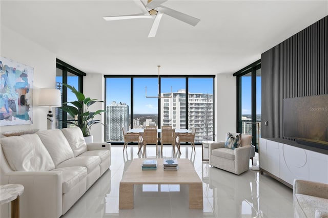 living room featuring expansive windows and ceiling fan