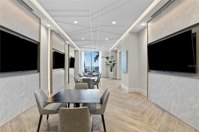 dining area featuring light parquet flooring