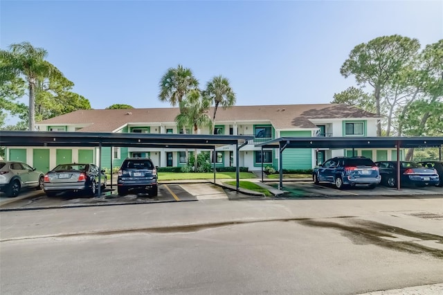 view of vehicle parking with a carport