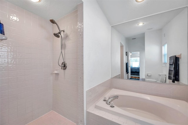 bathroom with a textured ceiling and toilet