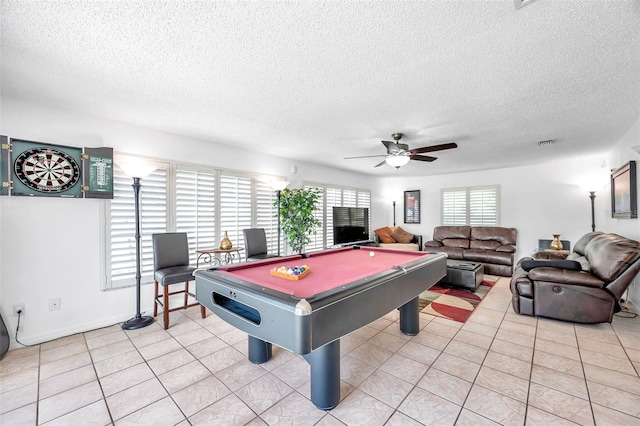 playroom with light tile patterned flooring, a textured ceiling, pool table, and ceiling fan