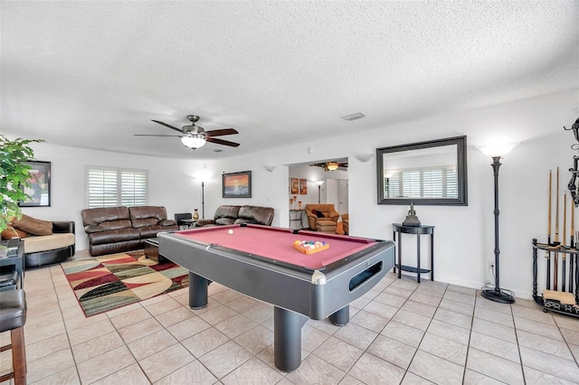 recreation room with light tile patterned flooring, a textured ceiling, ceiling fan, and billiards