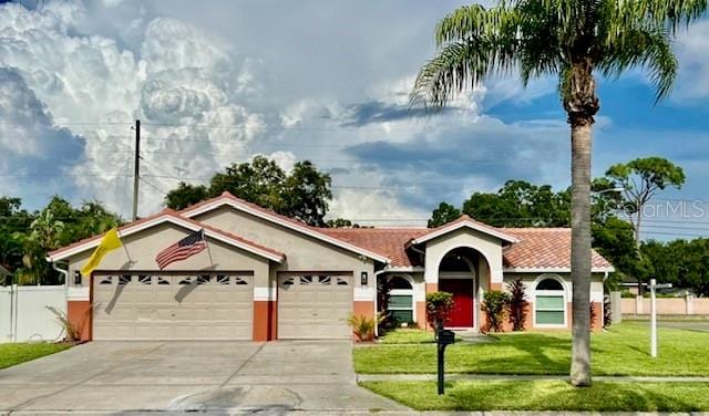 view of front facade featuring a garage and a front yard