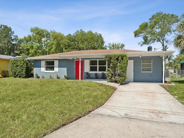 ranch-style home featuring central AC unit and a front lawn