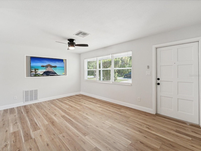 interior space with ceiling fan and light wood-type flooring