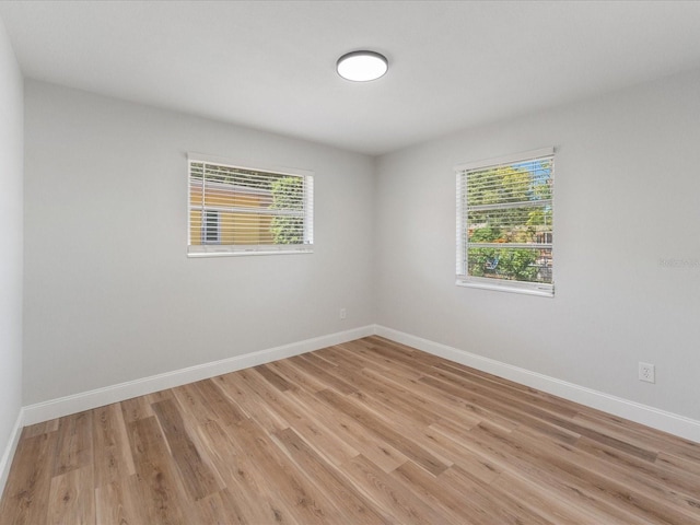 unfurnished room with light hardwood / wood-style flooring