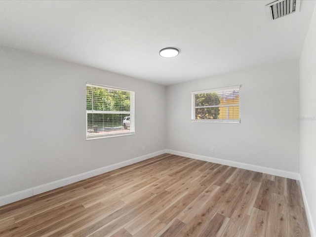 spare room featuring light hardwood / wood-style flooring