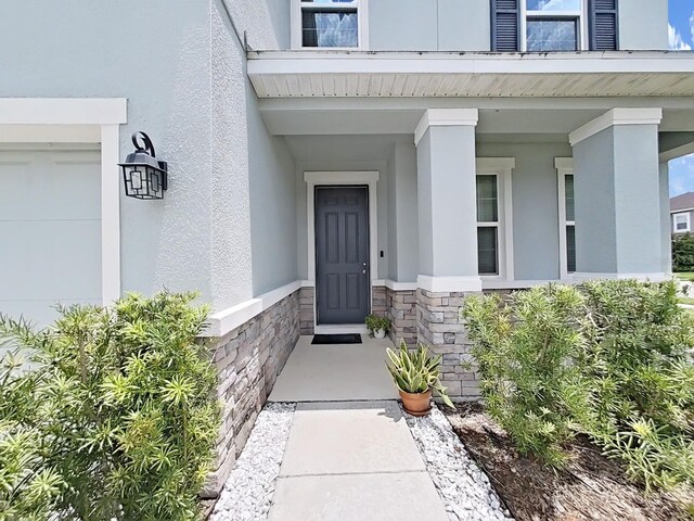 property entrance featuring a garage