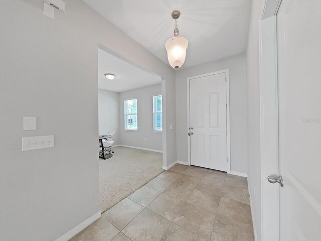 entryway featuring light tile patterned flooring