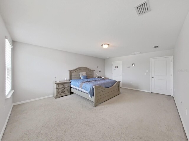 unfurnished bedroom featuring carpet and multiple windows