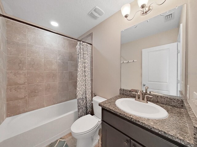 full bathroom with a textured ceiling, tile patterned flooring, vanity, toilet, and shower / bathtub combination with curtain