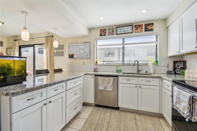 kitchen with tasteful backsplash, light tile patterned floors, white cabinets, stainless steel dishwasher, and sink