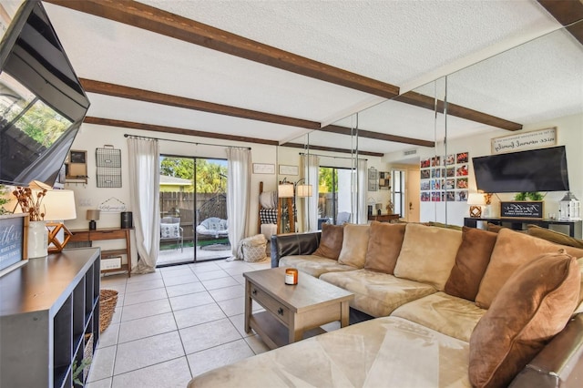 tiled living room with beam ceiling, a wealth of natural light, and a textured ceiling