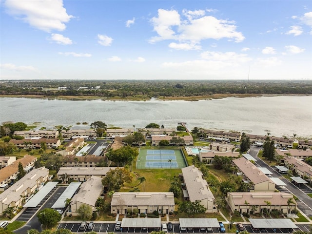 birds eye view of property with a water view