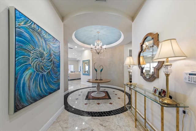 hallway with a notable chandelier