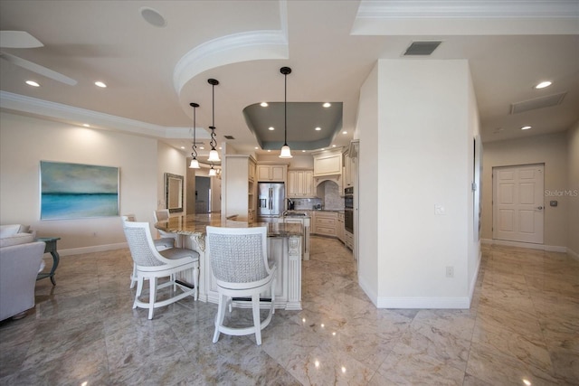 kitchen with a breakfast bar, decorative light fixtures, stainless steel fridge with ice dispenser, a center island with sink, and ornamental molding