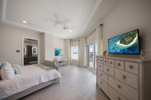 bedroom with access to outside, a raised ceiling, ceiling fan, and ensuite bathroom