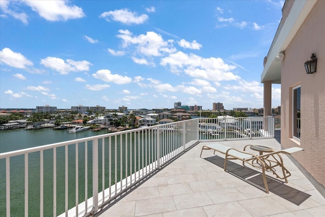 balcony featuring a water view