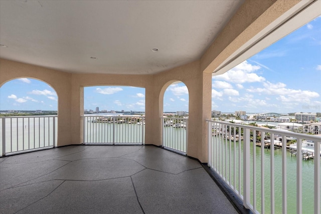 balcony featuring a water view