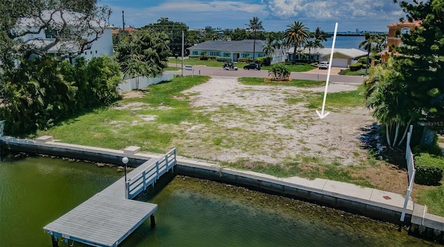 exterior space featuring a dock and a water view