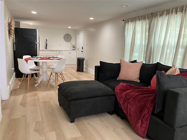 living room with light hardwood / wood-style floors