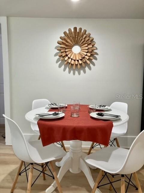 dining area with light hardwood / wood-style floors