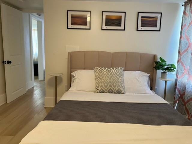 bedroom featuring hardwood / wood-style floors