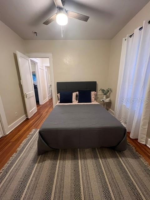 bedroom featuring hardwood / wood-style floors and ceiling fan