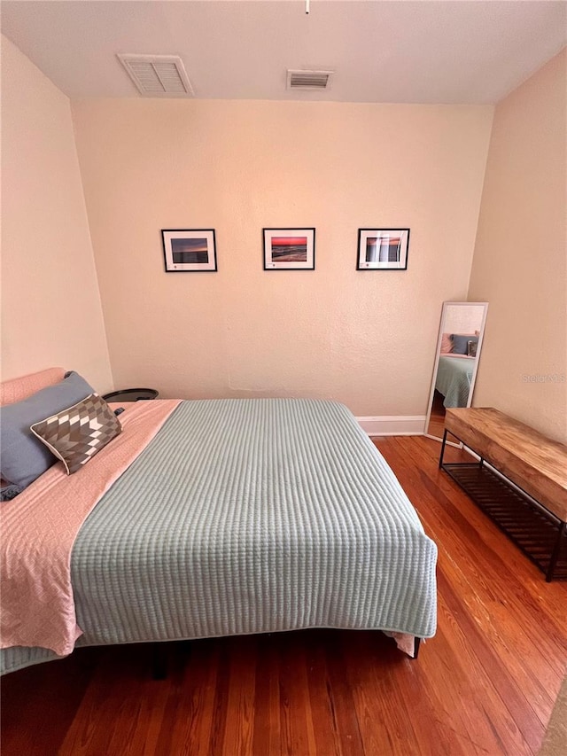 bedroom featuring hardwood / wood-style flooring