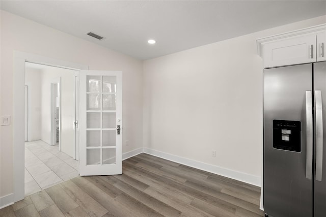 unfurnished dining area with hardwood / wood-style floors